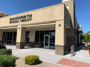Farnsworth Physical Therapy Board on a Building Exterior