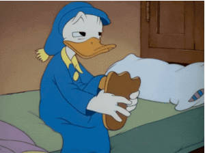 Donald Duck Rubbing Foot on the Bed Moving Image
