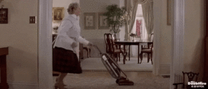 Dancing lady vacuuming moving image