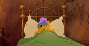 A cartoon character is peacefully resting in a bed.