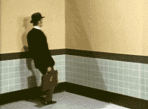 A Man in a Suit With a Briefcase Dancing