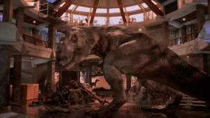T rex moving around and destroying motion image